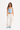 blue adidas corset and white adidas trackpant with orange stripes